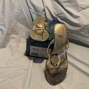 Size 8 barely worn Impo gold sandals, excellent condition slight wear on bottom
